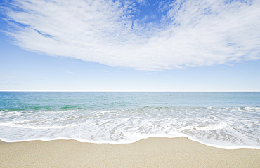 Ocean waves on sandy beach