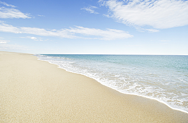 Ocean waves on sandy beach
