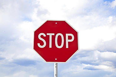 Stop sign against sky