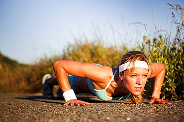 Runner doing push ups