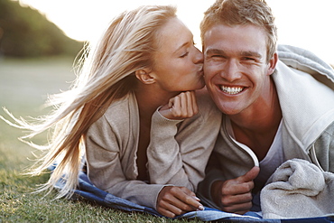 Woman kissing boyfriend