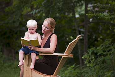 Woman reading to son