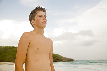 Boy standing on beach