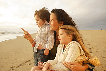 Mother and children at beach