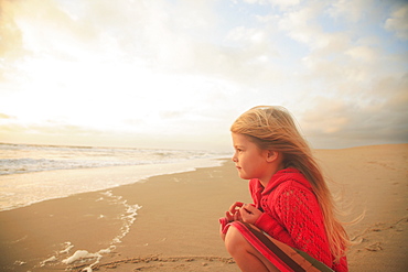 Girl sitting on beach