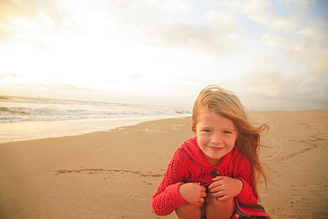 Girl sitting on beach