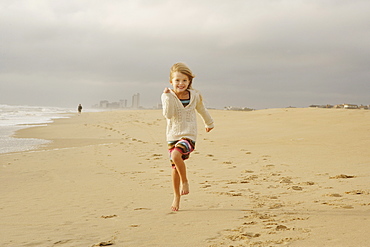 Girl running on beach