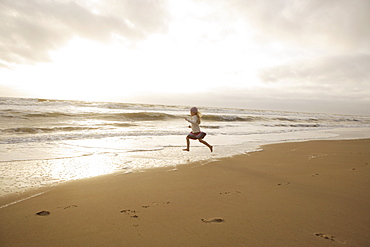 Girl running on beach