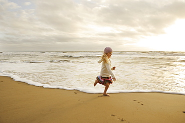 Girl running on beach