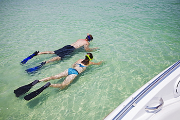 Father and daughter snorkeling in water, Florida, United States