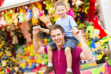 Happy father with son (4-5) in amusement park, USA, Utah, Salt Lake City 