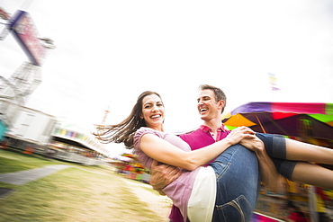 Couple in amusement park, USA, Utah, Salt Lake City 