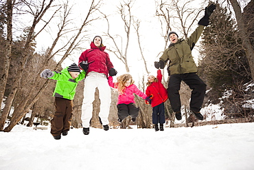 Three children (2-3, 4-5) with parents during stroll, USA, Utah, Highland
