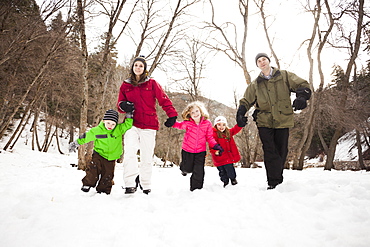 Three children (2-3, 4-5) with parents during stroll, USA, Utah, Highland