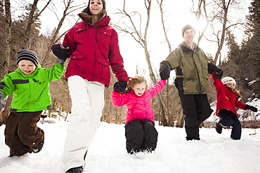 Three children (2-3, 4-5) with parents during stroll, USA, Utah, Highland