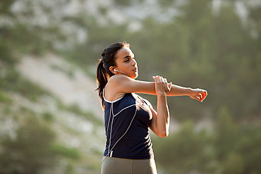 France, Marseille, Young woman stretching, France, Marseille