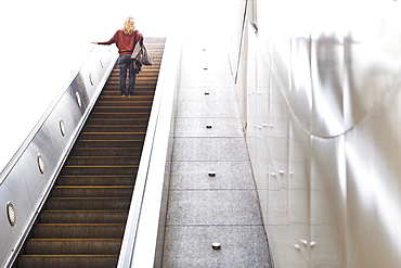 USA, California, Los Angeles, Woman on escalator in subway station