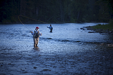 Canada, British Columbia, Fernie, Women fly fishing in river