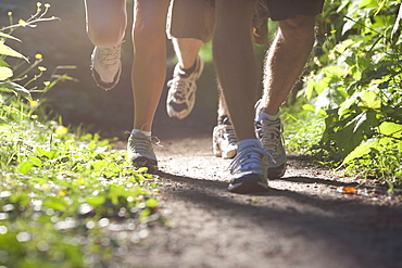 Canada, British Columbia, Fernie, Foot of three jogging people