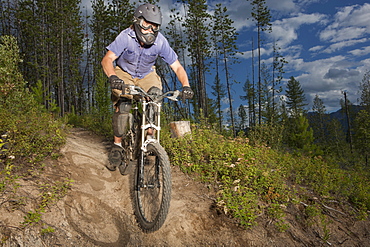 Canada, British Columbia, Fernie, Mid adult man enjoying mountain biking