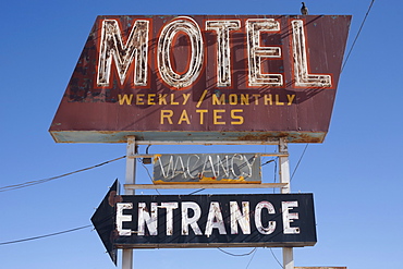 USA, Arizona, Winslow, Old-fashioned motel sign against blue sky