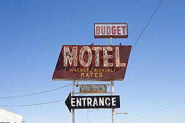 USA, Arizona, Winslow, Old-fashioned motel sign against blue sky