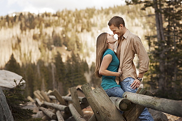 Happy couple embracing in rural setting