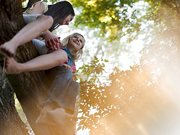 Two girls sitting in a tree