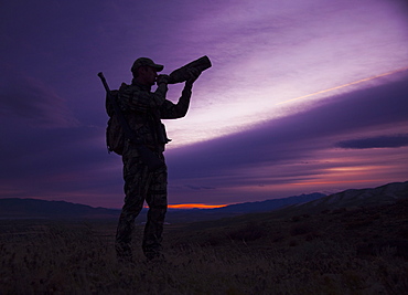 Big game hunter at dusk