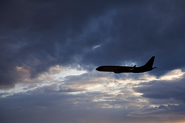 Commercial jet in cloudy sky