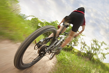 Cyclist on single track trail