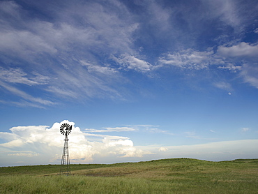 Windmill in field