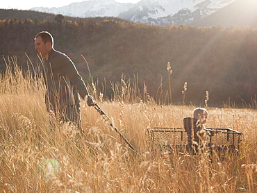 Father pulling son in wagon