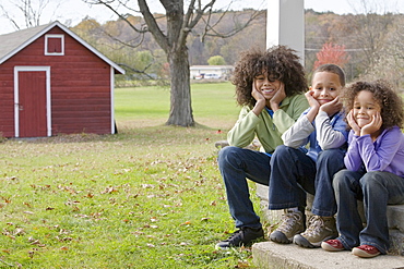 Family sitting on porch