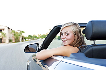 Woman driving convertible