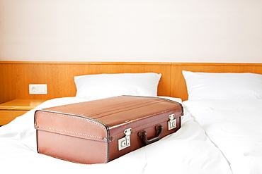 Suitcase on bed