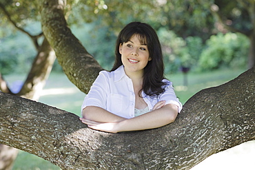 Young woman smiling in forest