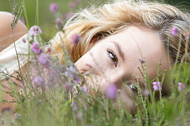 Woman relaxing on meadow