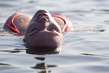 Woman relaxing in lake