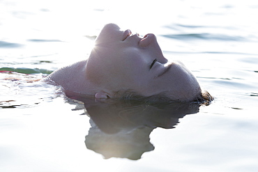 Woman relaxing in lake