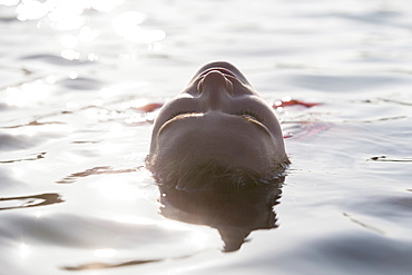 Woman relaxing in lake
