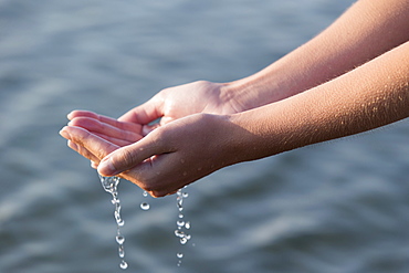 Woman's hands with waterdrops