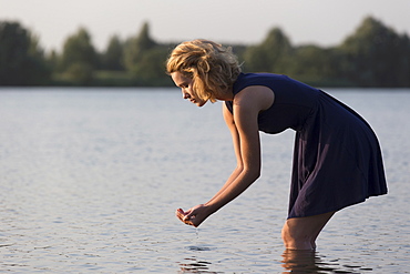 Beautiful woman in lake, Netherlands, Gelderland, De Rijkerswoerdse Plassen