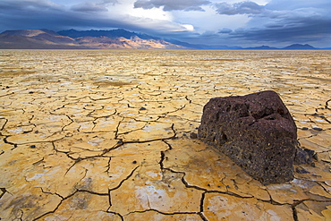 Stormy clouds over cracked earth, USA, Oregon