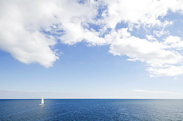 Lonely sailboat on ocean