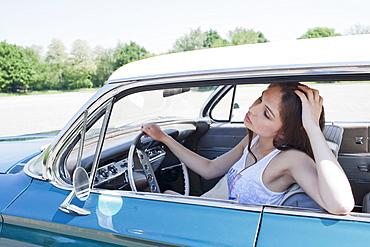 Woman in vintage car, Netherlands, Tilburg