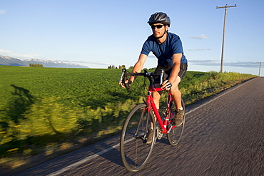 USA, Montana, Kalispell, Cyclist captured in motion, USA, Montana, Kalispell