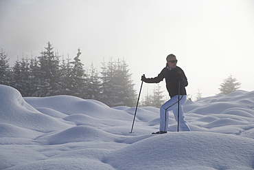 Young woman hiking in winter scenery