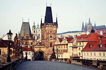 View over Charles Bridge towards Prague Castle in early morning