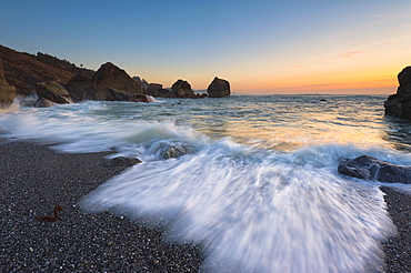 Blurred surf wave washing ashore